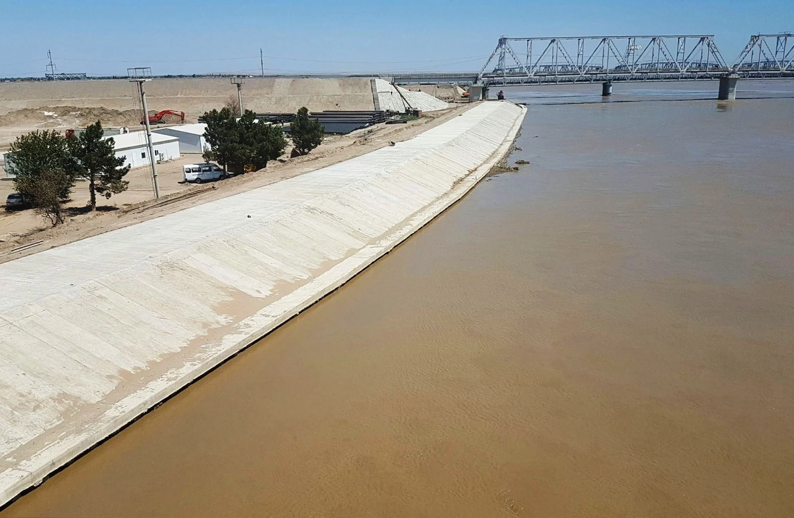 Concrete riverbank protection beside a bridge